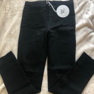 Black jeans with a couple rips